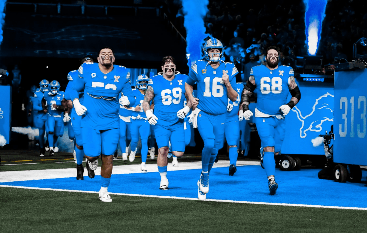 Detroit Lions QB Jared Goff leads offense onto field before game agaInst Steelers.